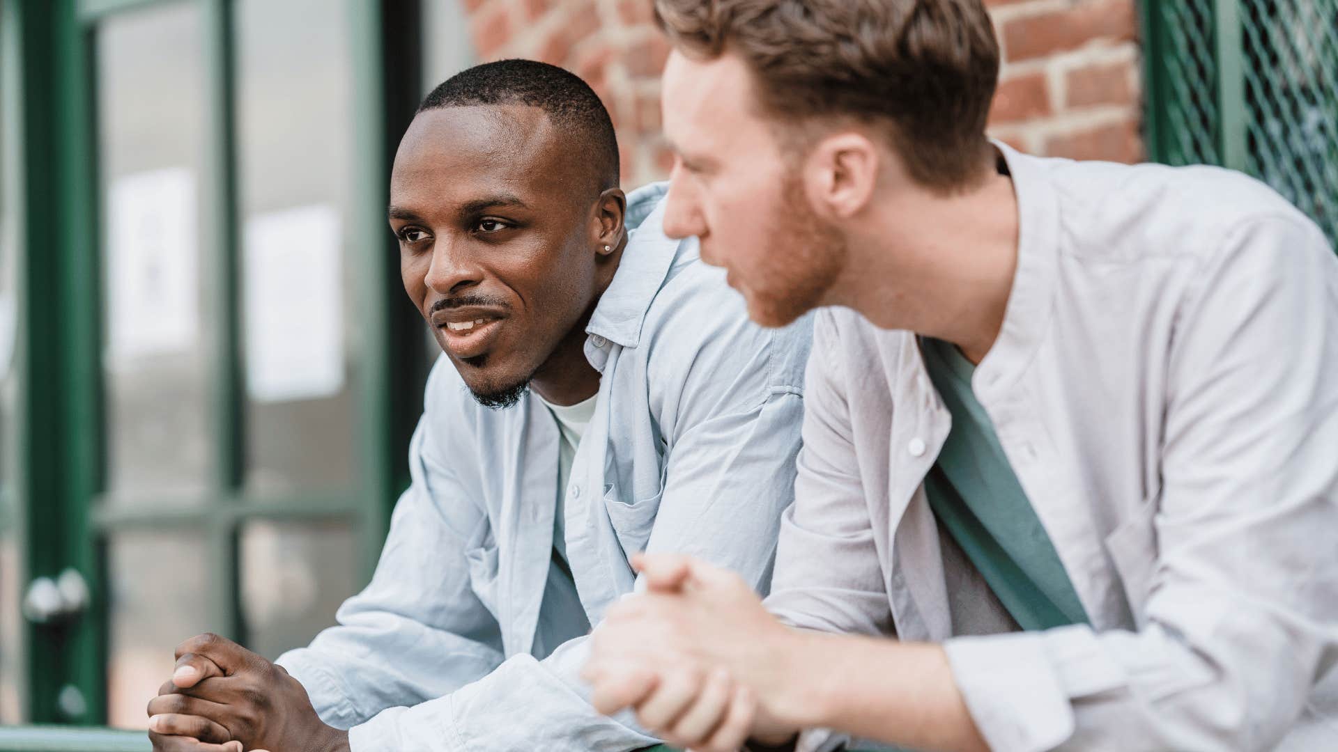 friendly man telling friend i can understand that in conversation