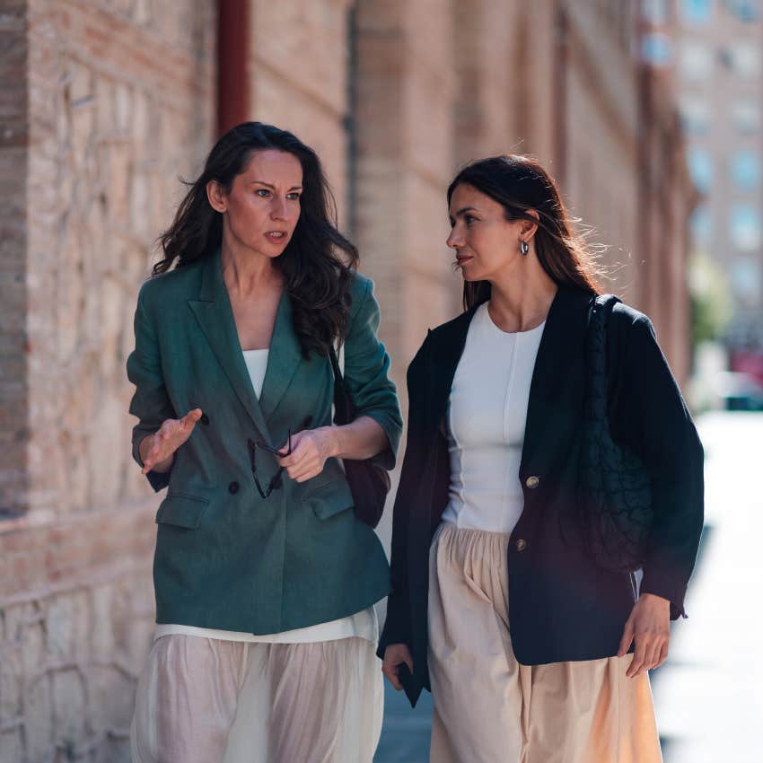 woman who is good at solving problems talking and walking with her friend asking "What can we control?"