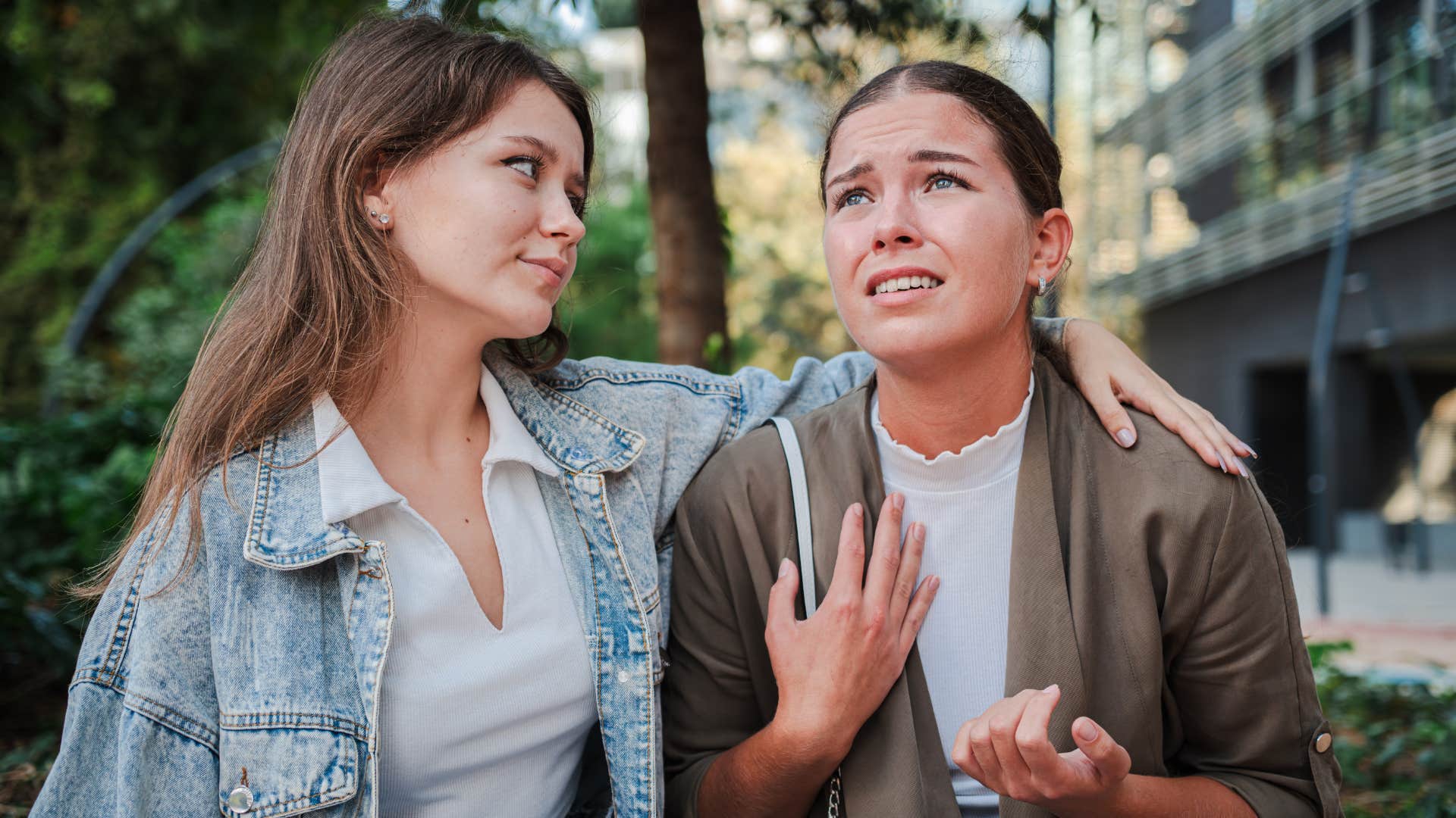 woman with low mental and emotional independence crying to friend asking her not to be upset with her