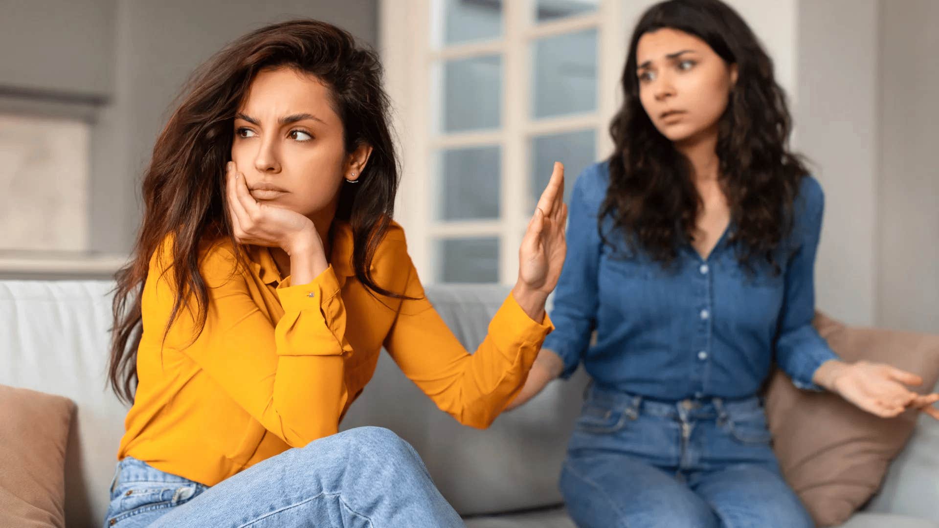 woman ignoring friend during heated exchange