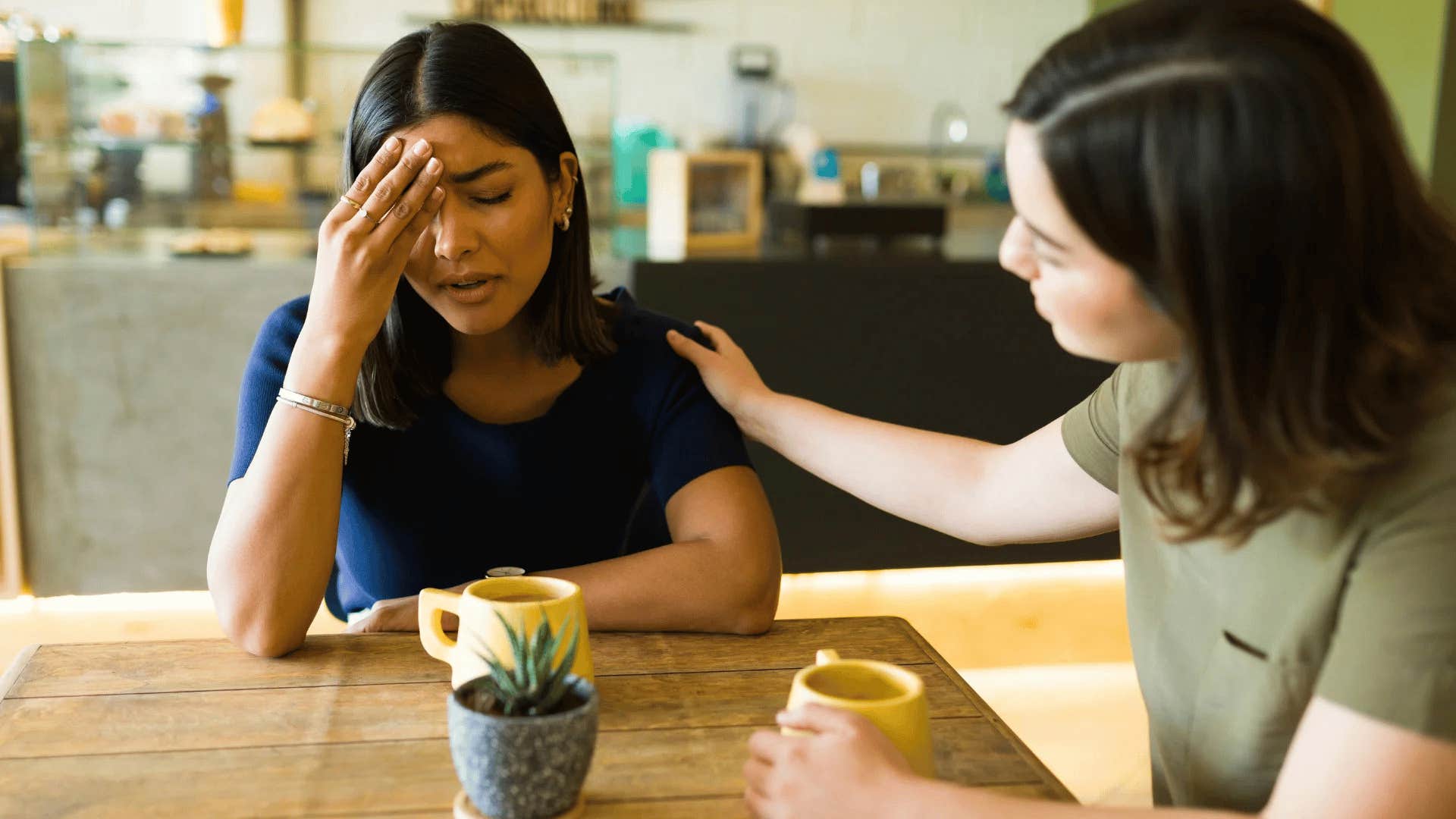 woman being comforted by friend and telling her you wouldn't get it