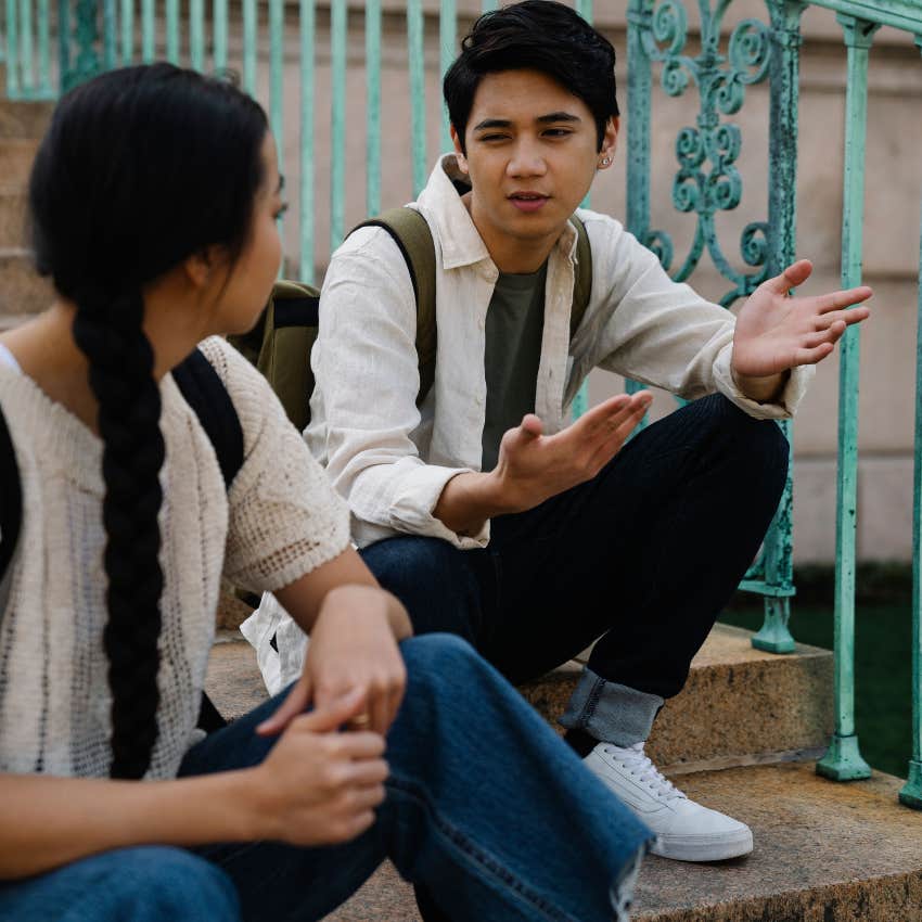 man pretending to be worried talking to friend on stoop looking for information