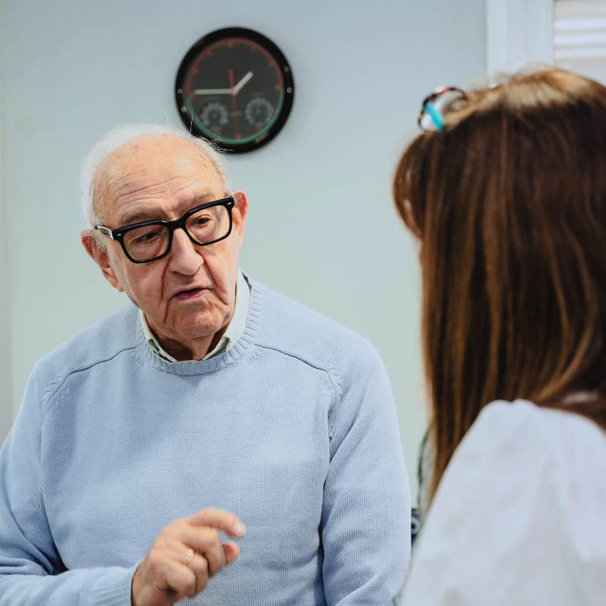older man telling young woman that's just what parents do at family dinner