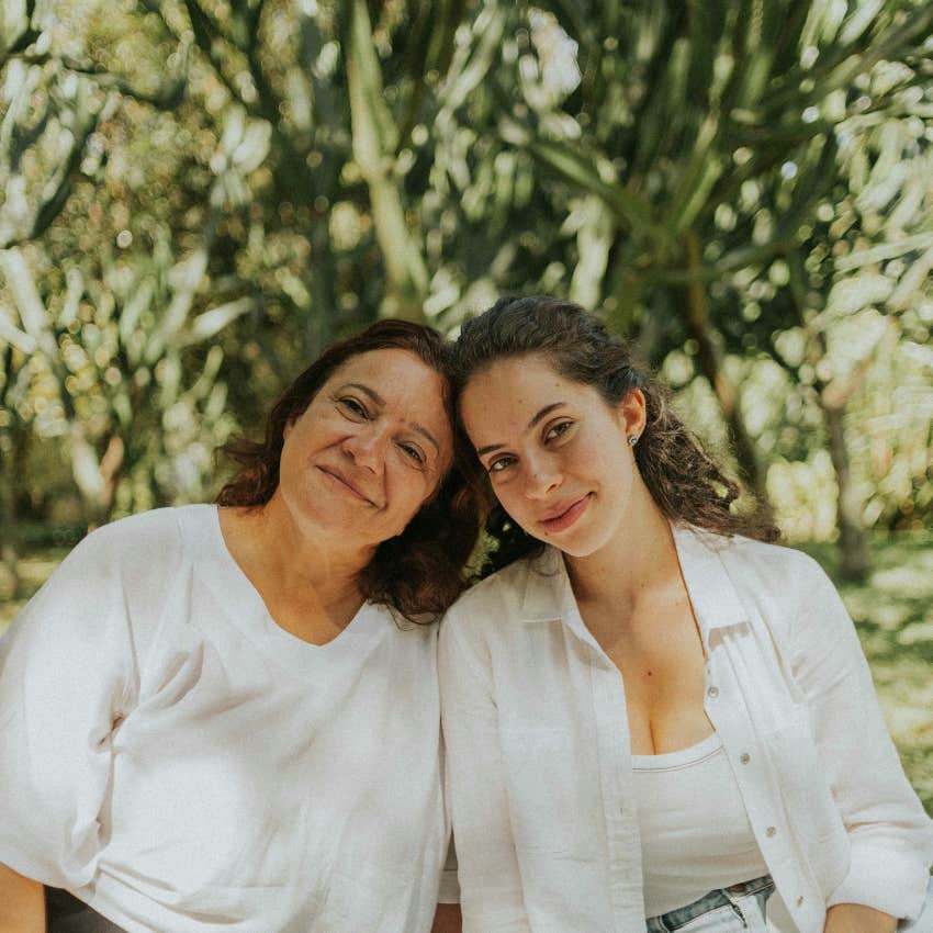 empathetic mother sitting with her daughter