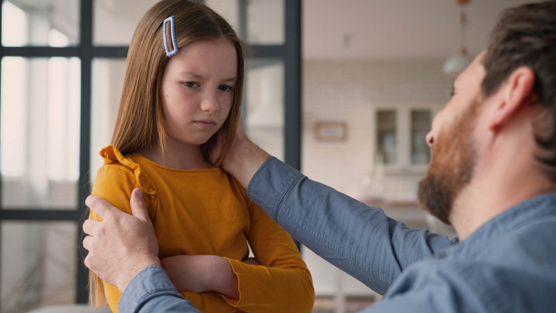 tough dad teaching his upset daughter to stay calm during hard times