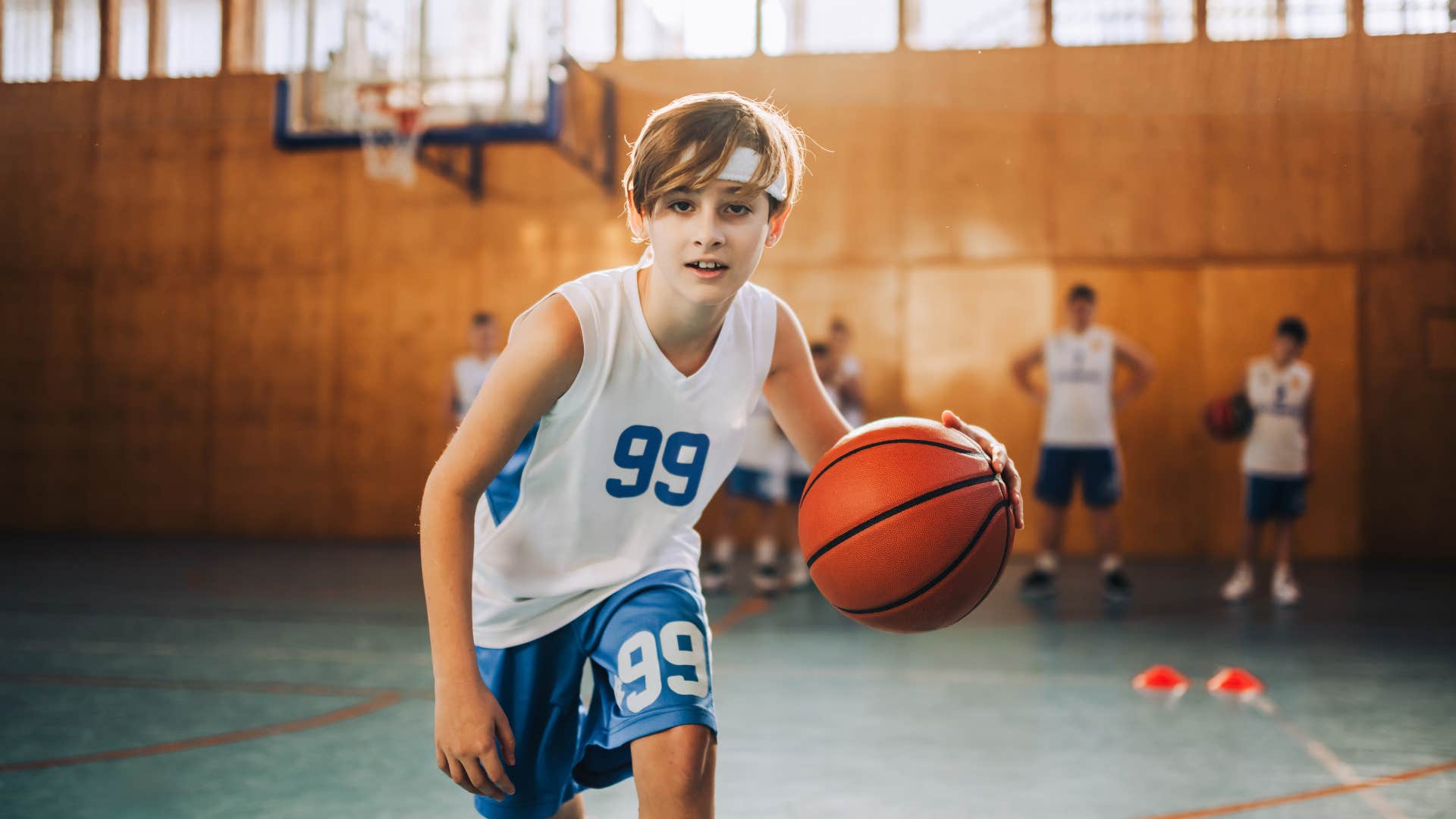 basketball playing teen boy with tough parents pushes through even when he lacks motivation