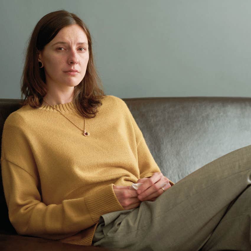 serious woman sitting alone