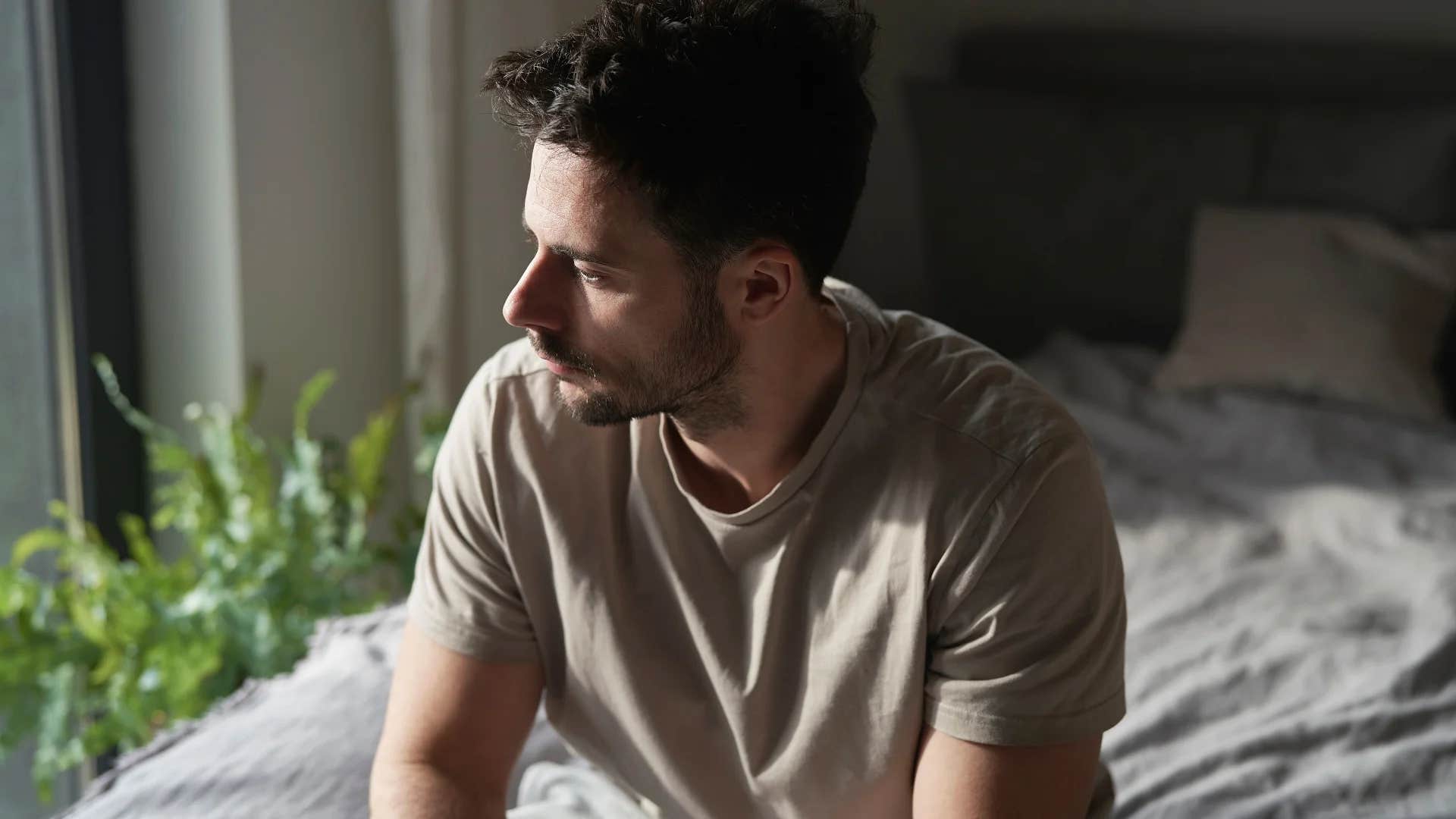 stressed man struggling to relax after getting home from work