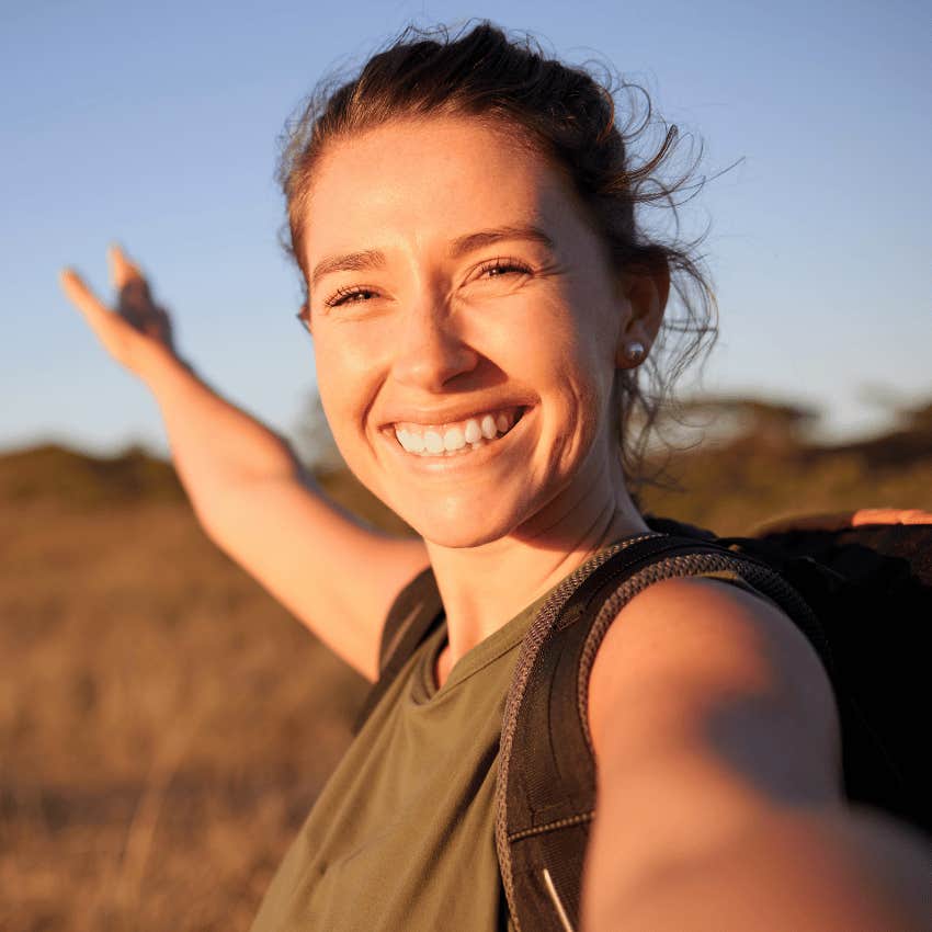 smiling woman outside during a digital detox