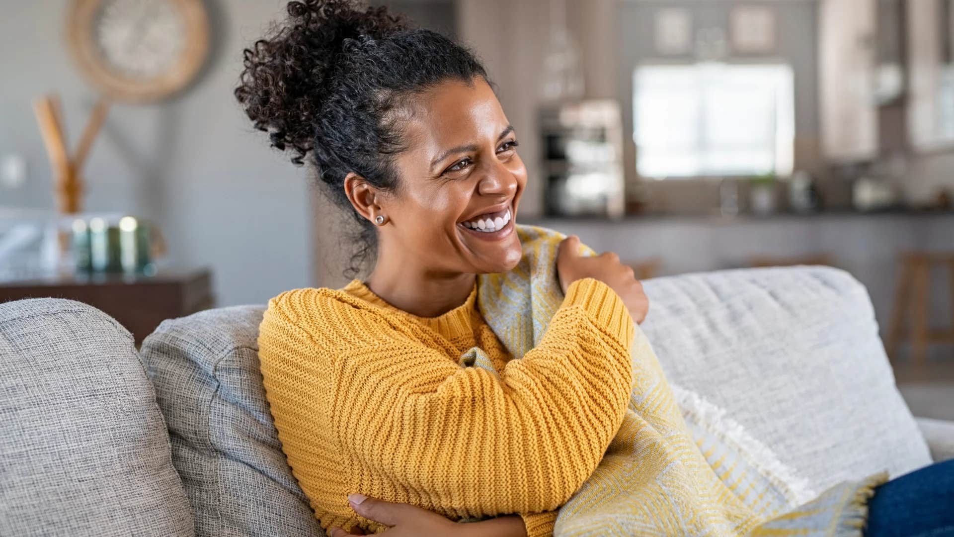 smiling woman protecting her peace by not calling her parents