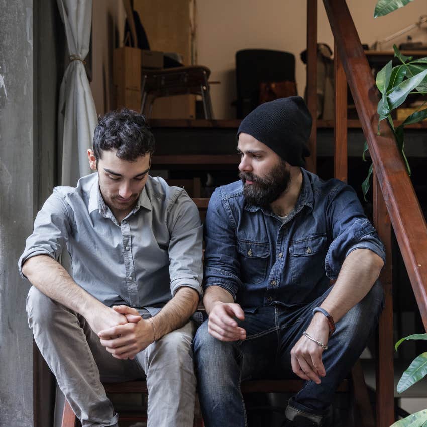 man in a beanie repeating the same story to his friend because he is empathetic and highly sensitive