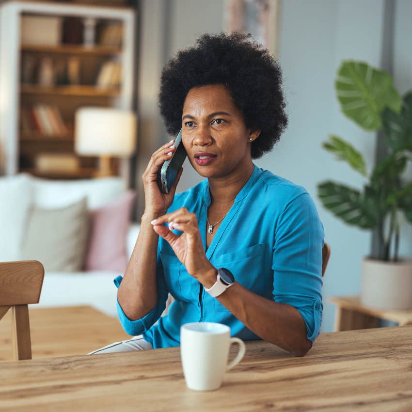 woman on phone repeating the same story to friend because she is a little unsure of herself
