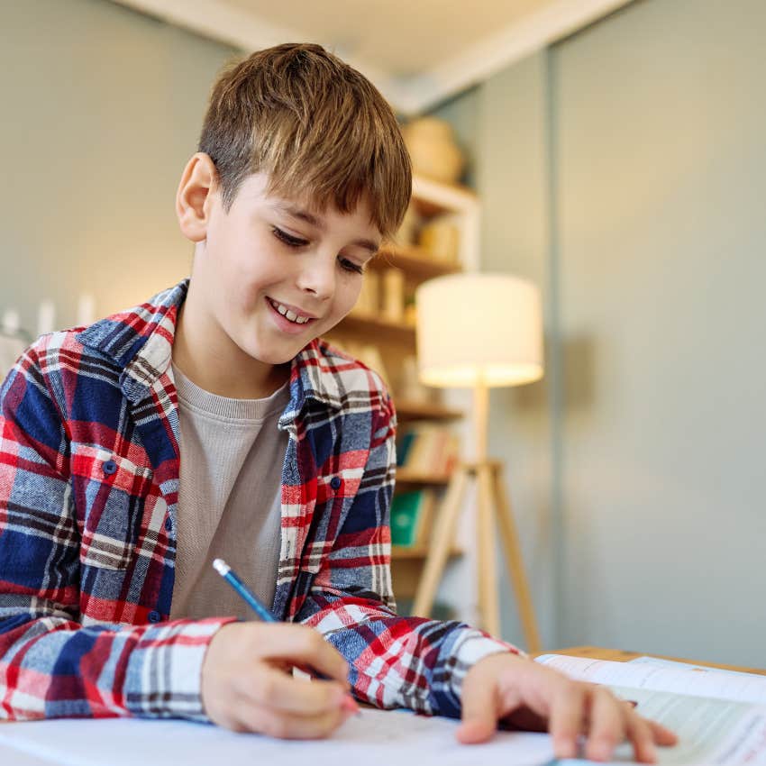 boy doing his homework managing his own time