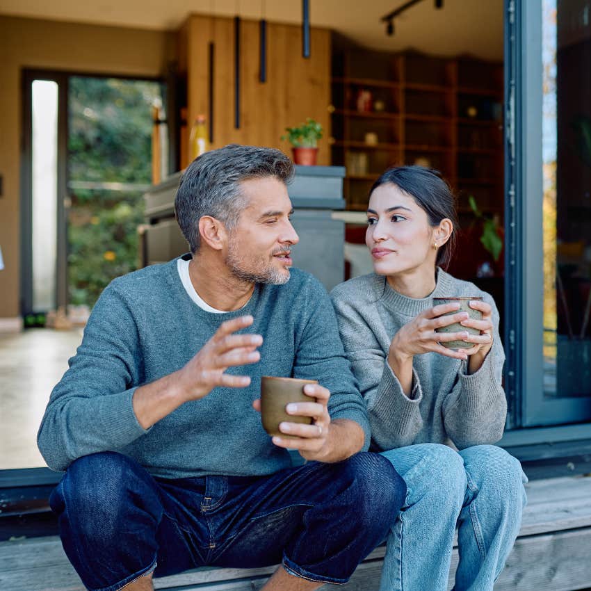 unusually happy couple talking over coffee connecting over intellectual intimacy