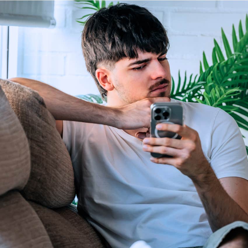 man looking at his phone refusing to be constantly available