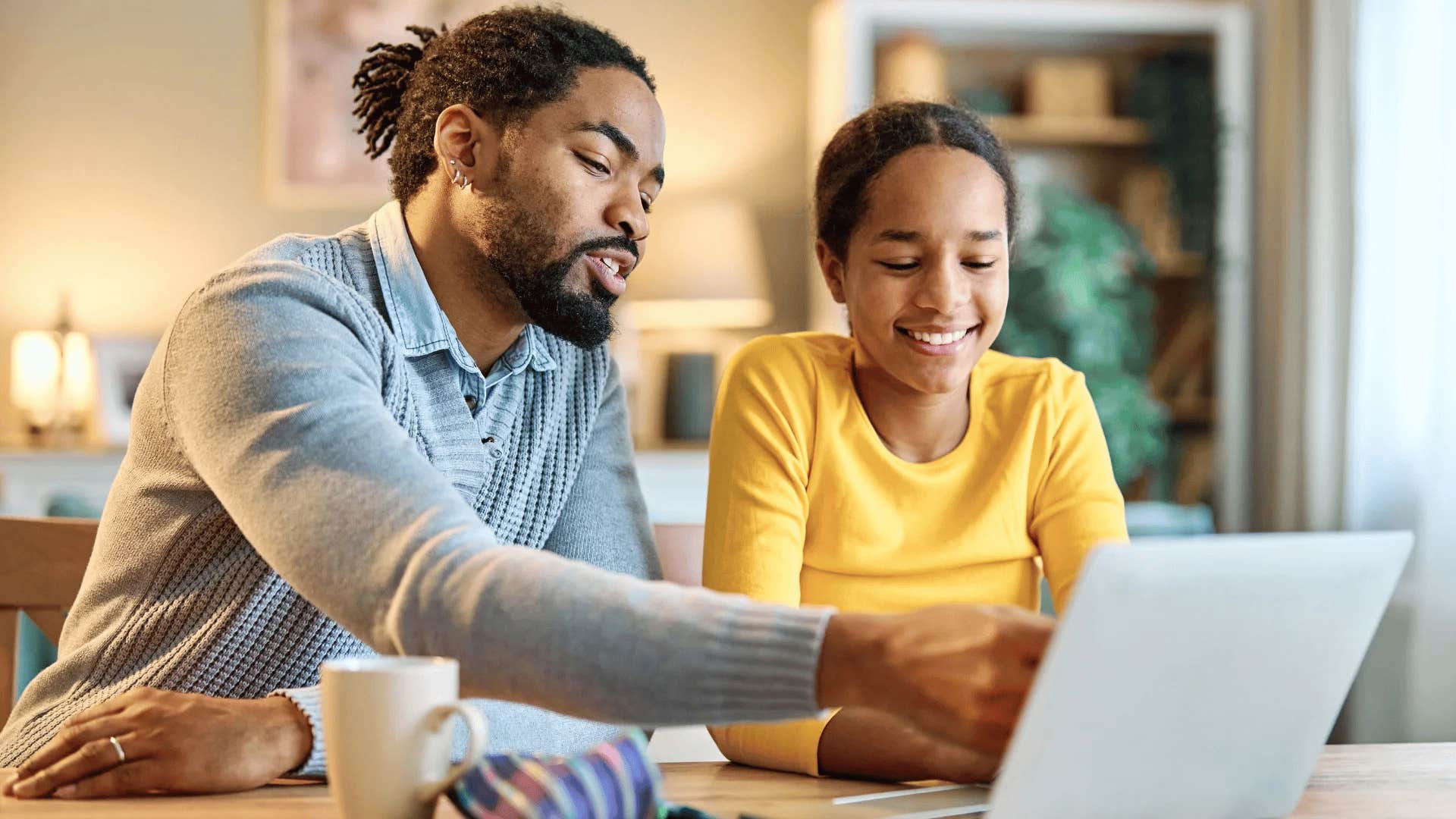 gen Z father teaching his daughter to be financially literate