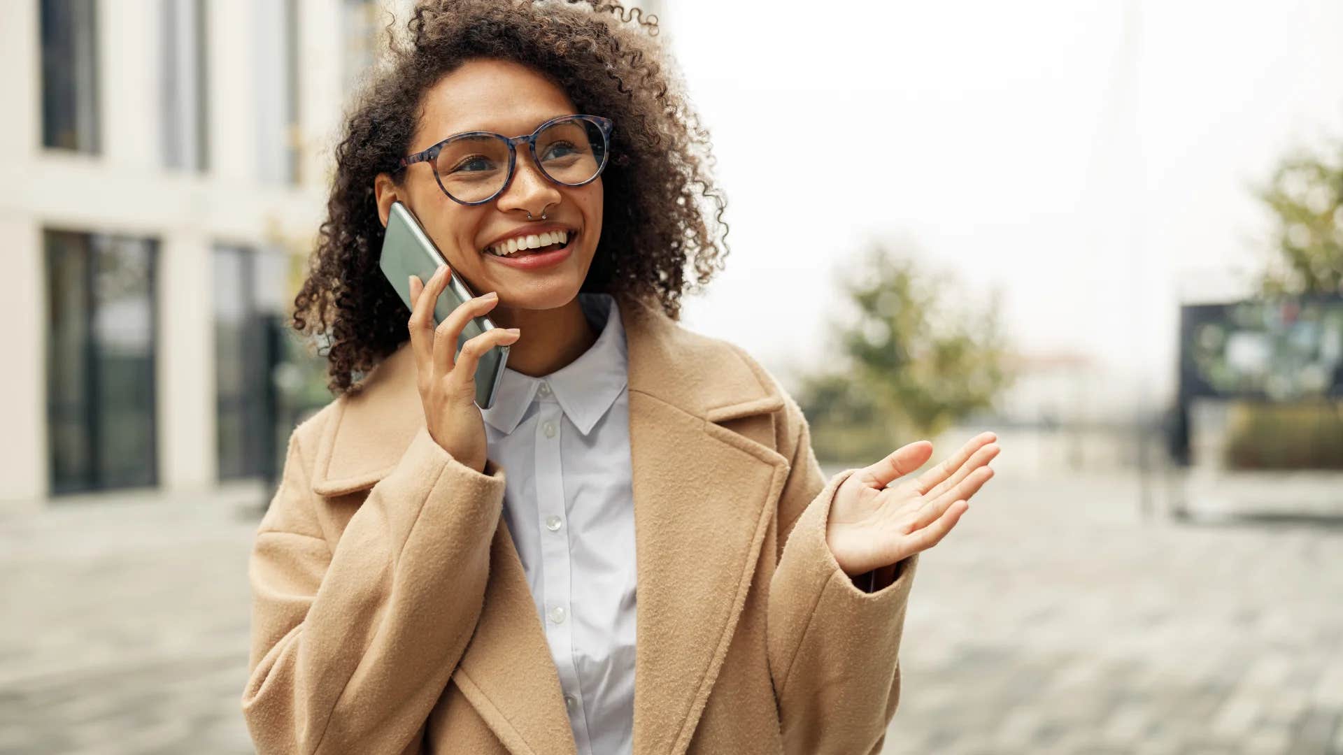 young woman talking on the phone laughing