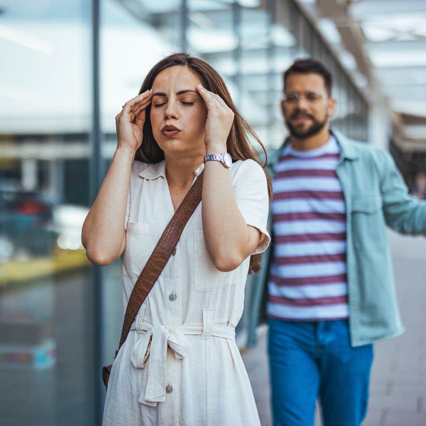 woman trying to get some space from insecure and clingy boyfriend