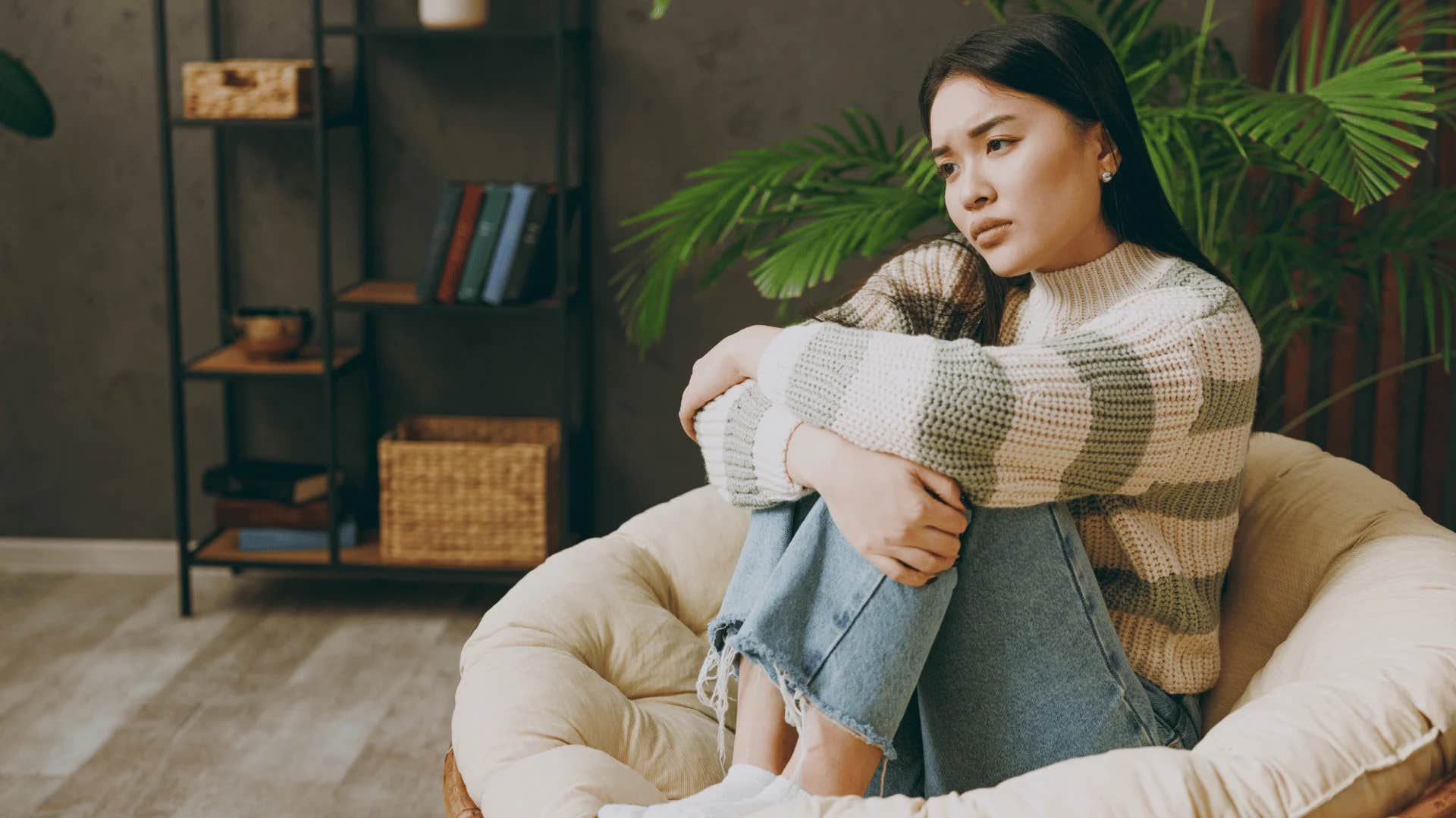 insecure woman wearing comfortable and casual jeans and a sweater