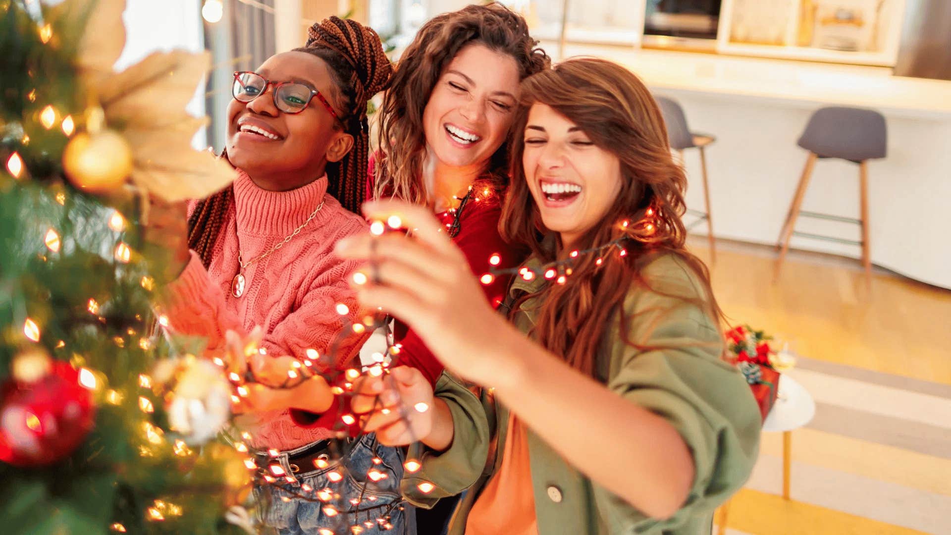 friend group decorating fake christmas tree to save money