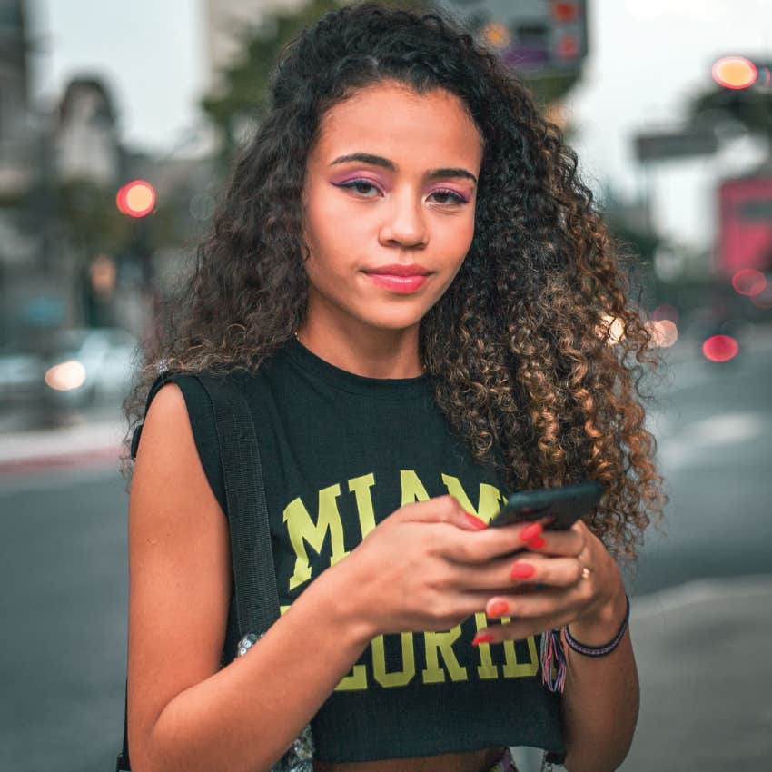 gen Z woman on her phone not following expectations to settle down
