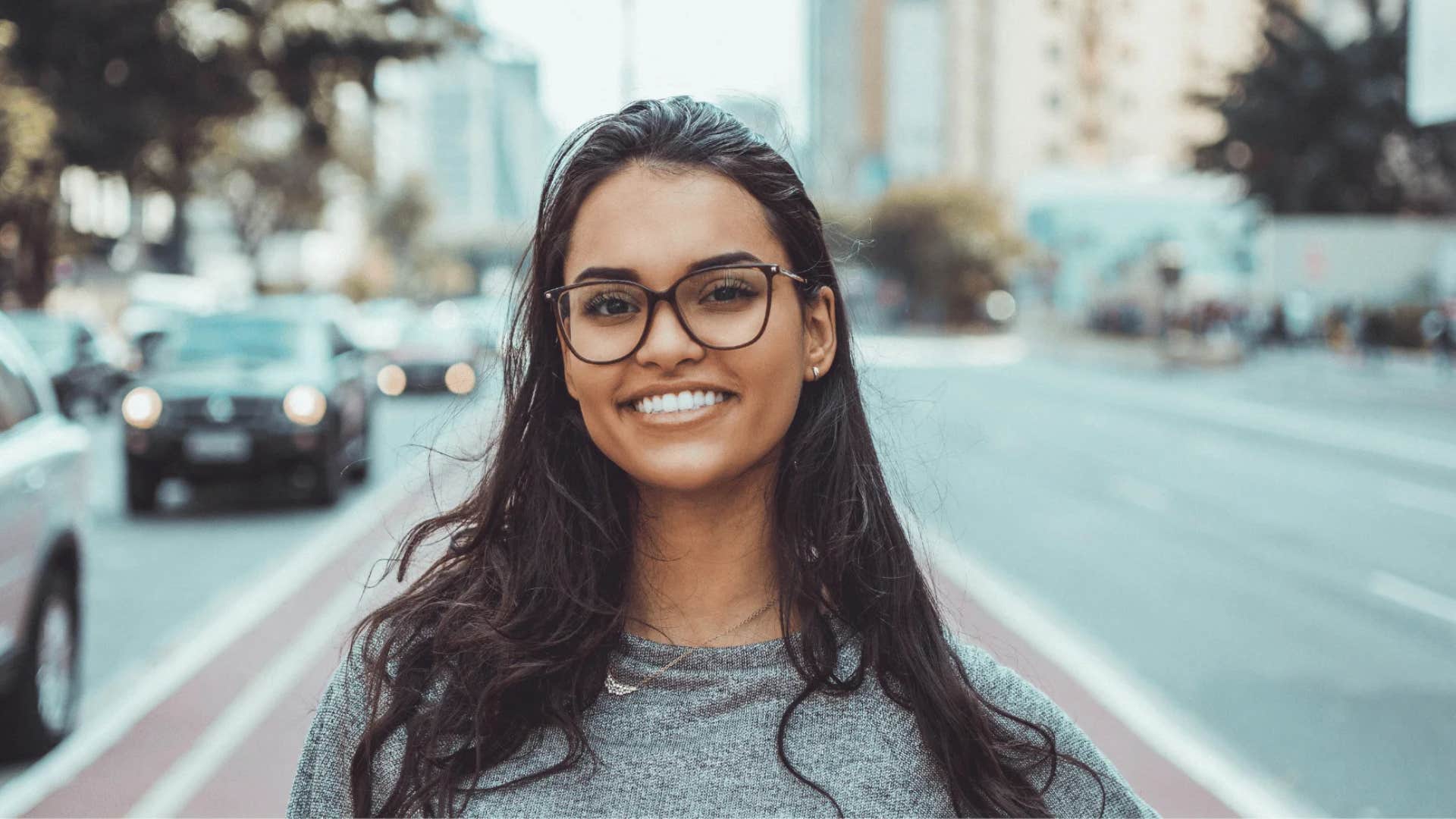 mentally strong woman who lets go of unhelpful thoughts smiling