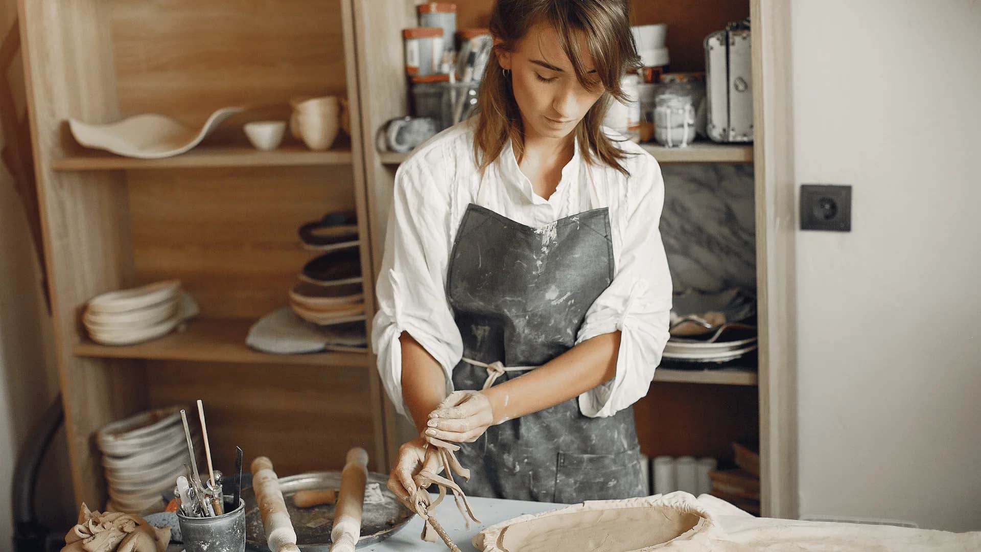 mentally strong woman making pottery and limiting overconsumption