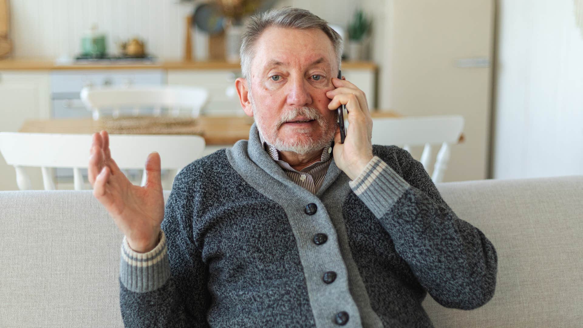 mature man with mental and emotional integrity turning down an invitation on the phone