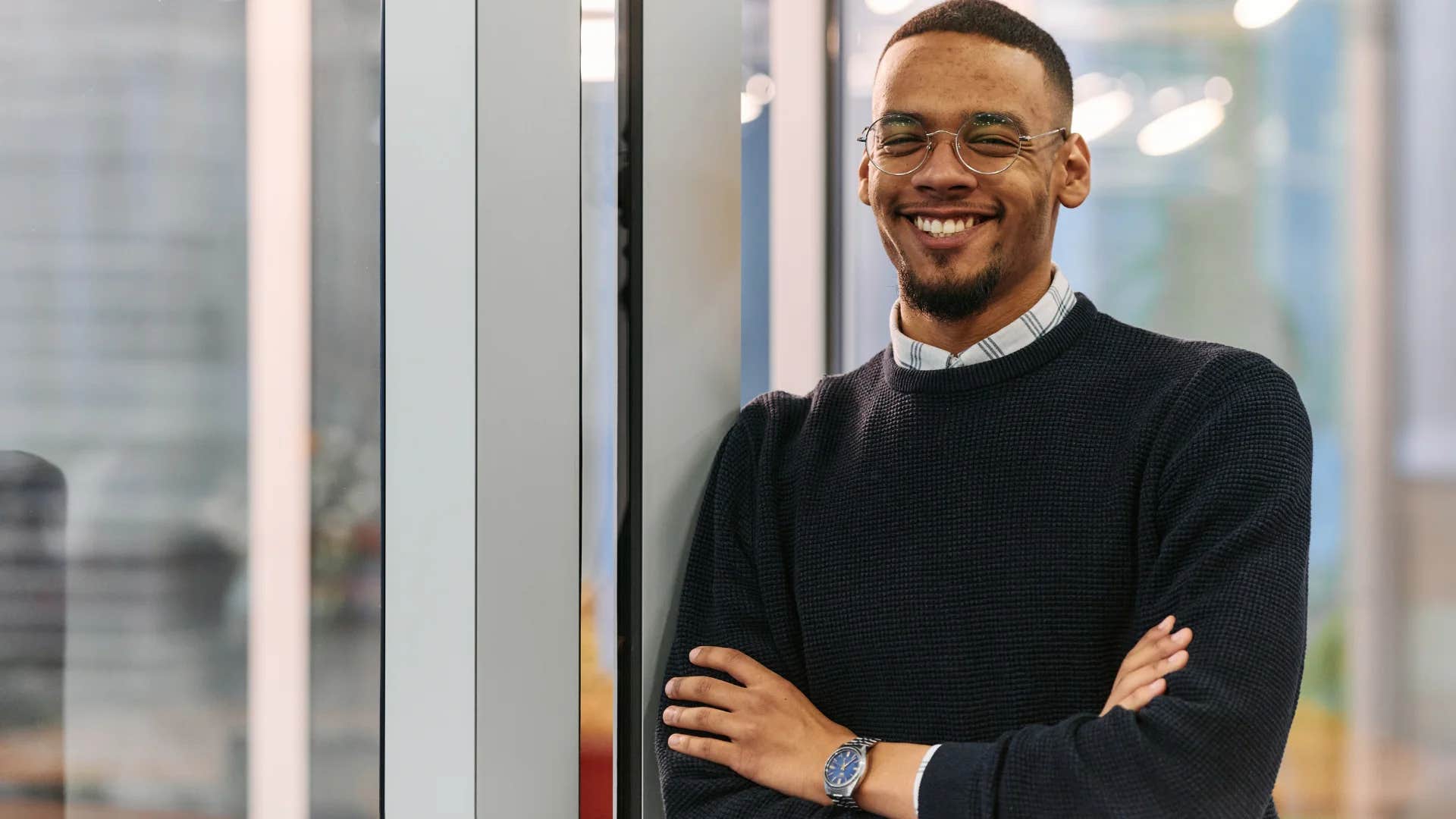 man feeling happy at work creating a vision for his future
