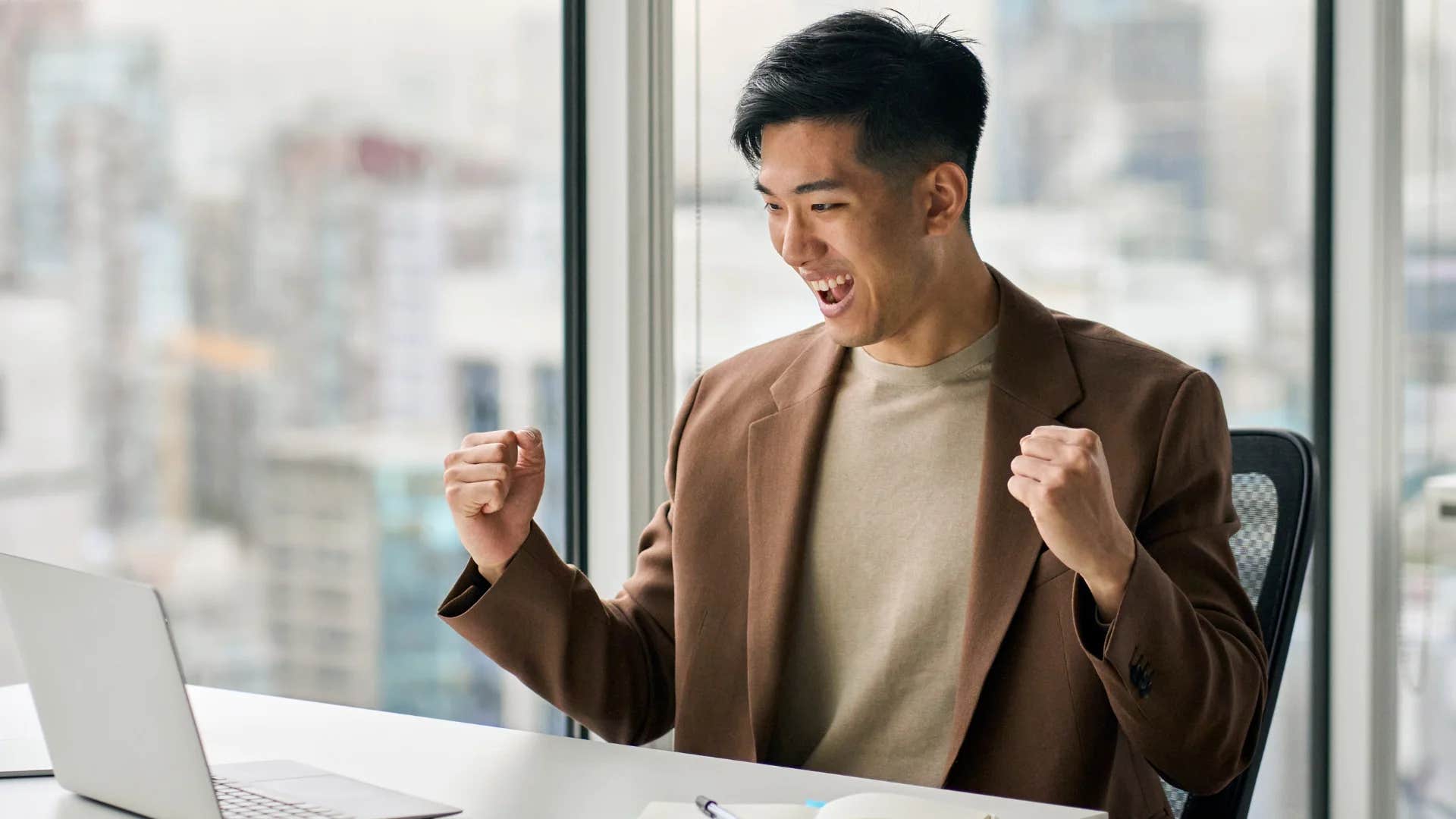 man enjoying his job making his workload into a fun game