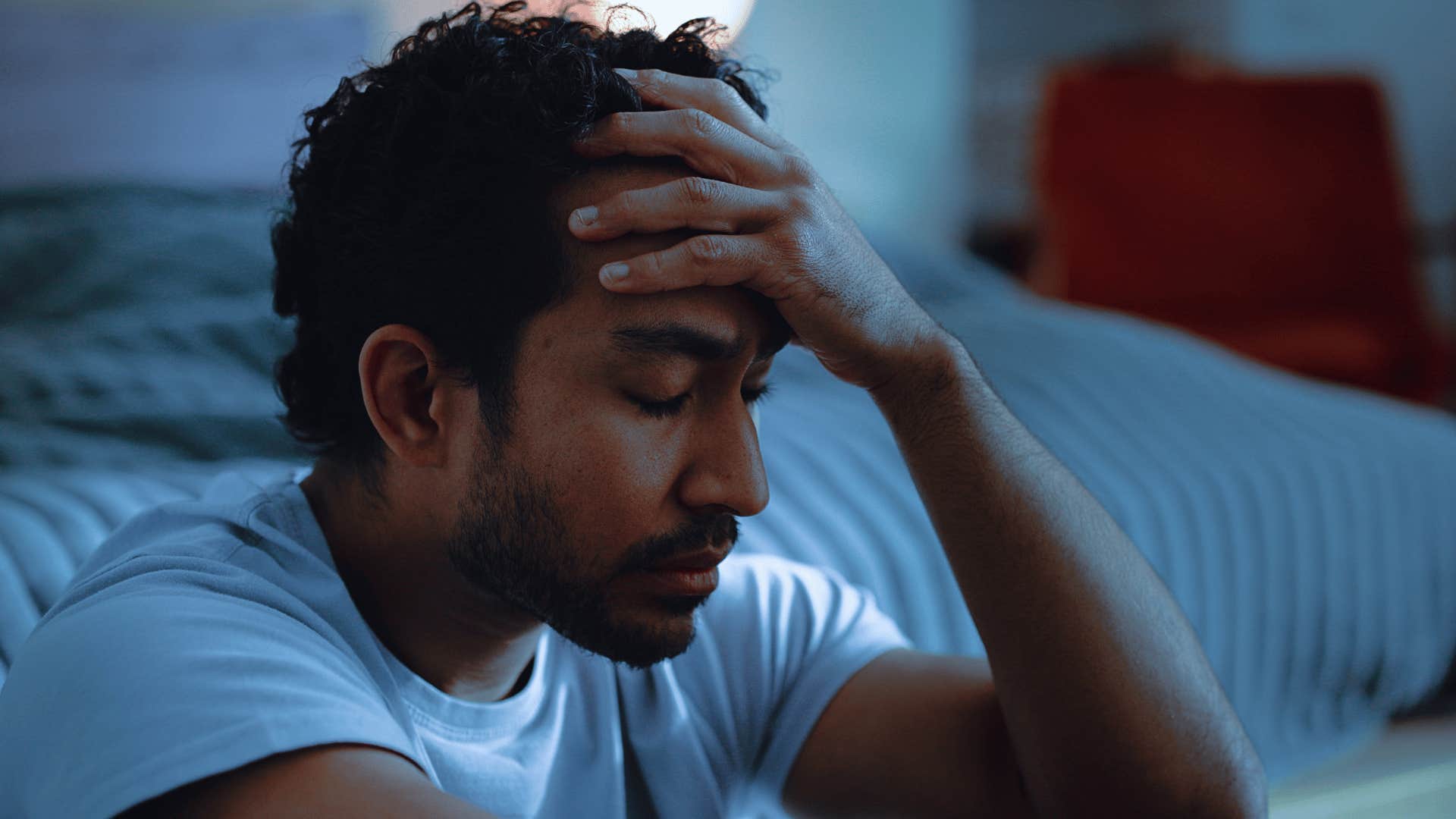 man in white shirt upset thinking what if their behavior gets worse