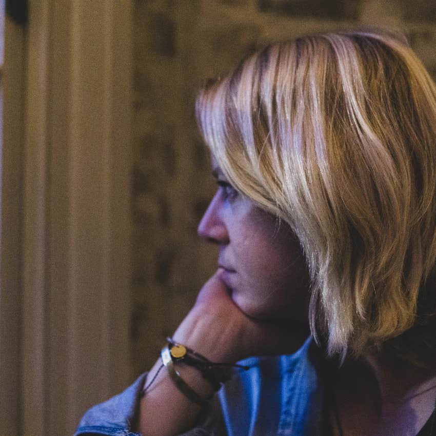 woman who's not even angry anymore because she knows she can't save her relationship