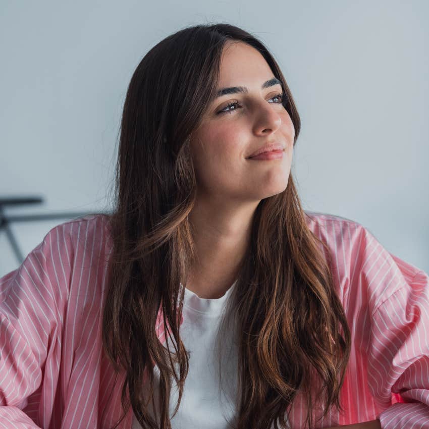 happy successful woman thinking through her decisions