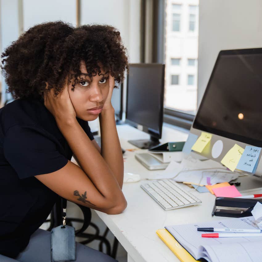 tired exhausted employee frustrated at having to work harder to prove herself