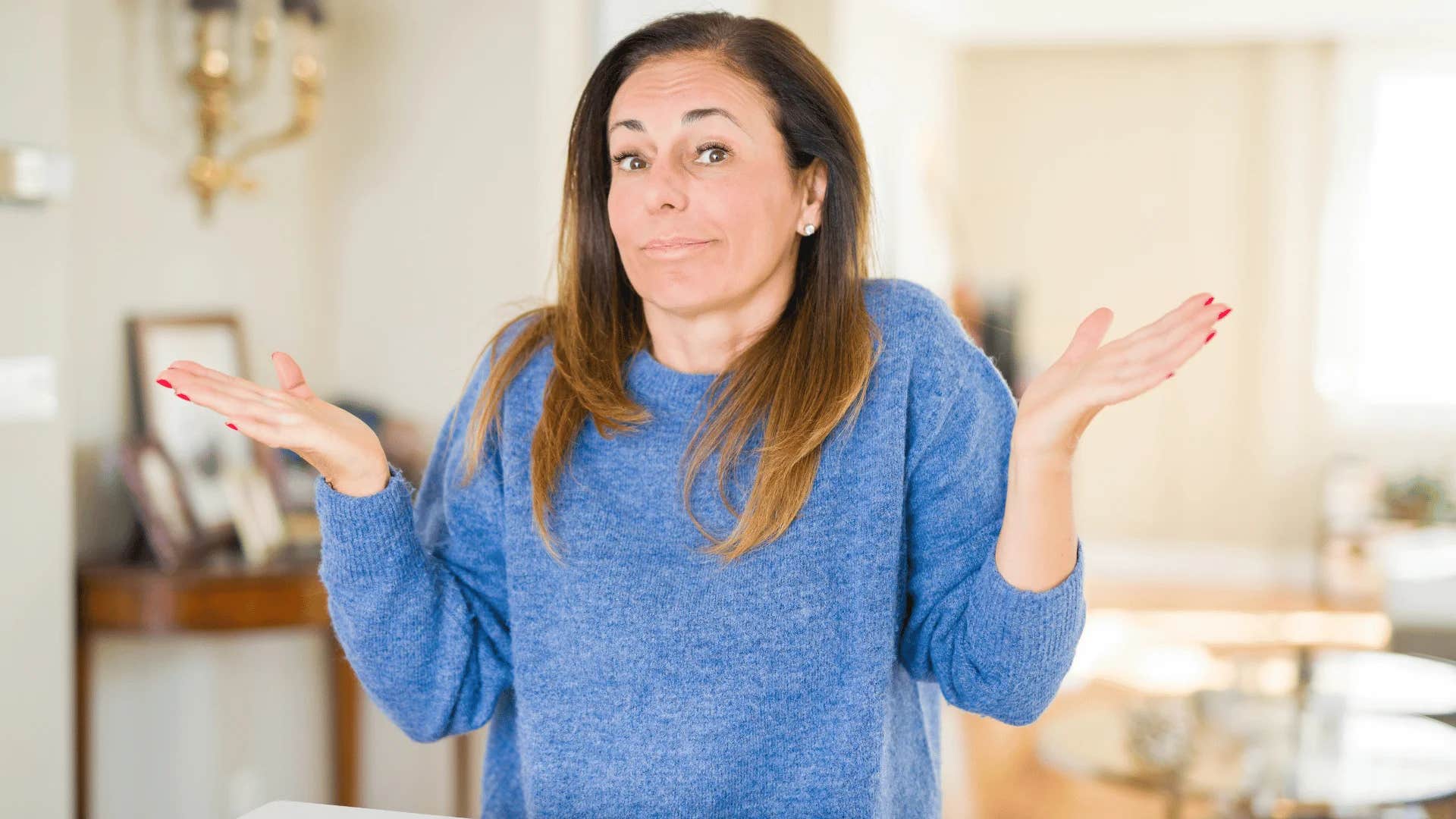 woman shrugging i'm only staying with you because it benefits me
