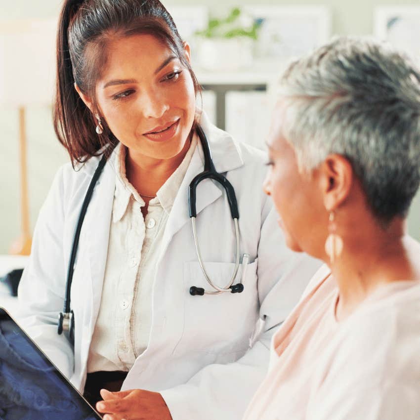 unhappy older woman speaking with female doctor