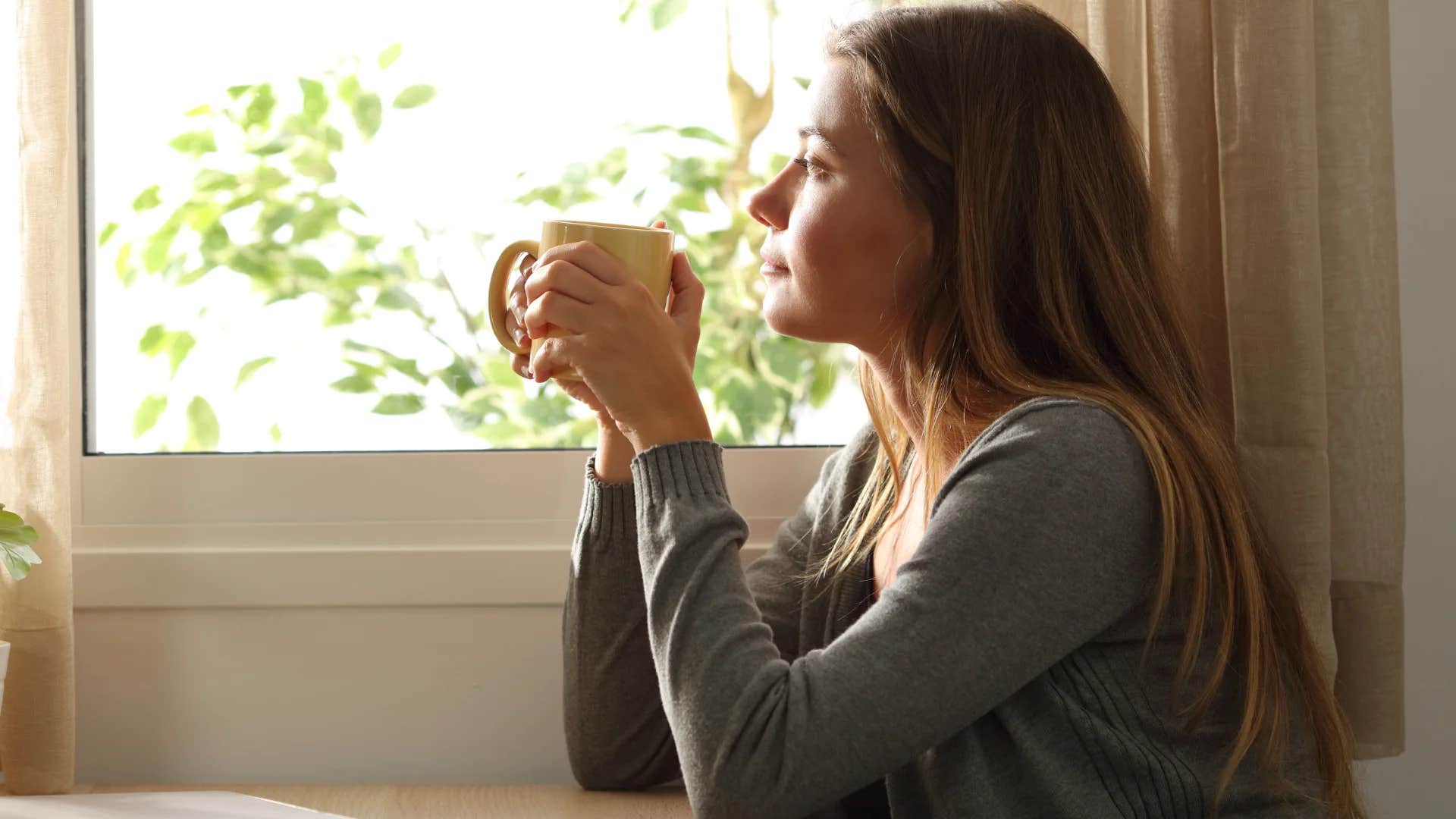 woman drinking coffee not responding to ex