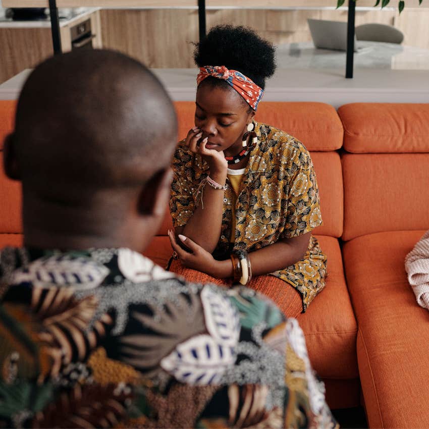 Woman quietly hiding her hurt feelings during an emotional conversation with someone close to her