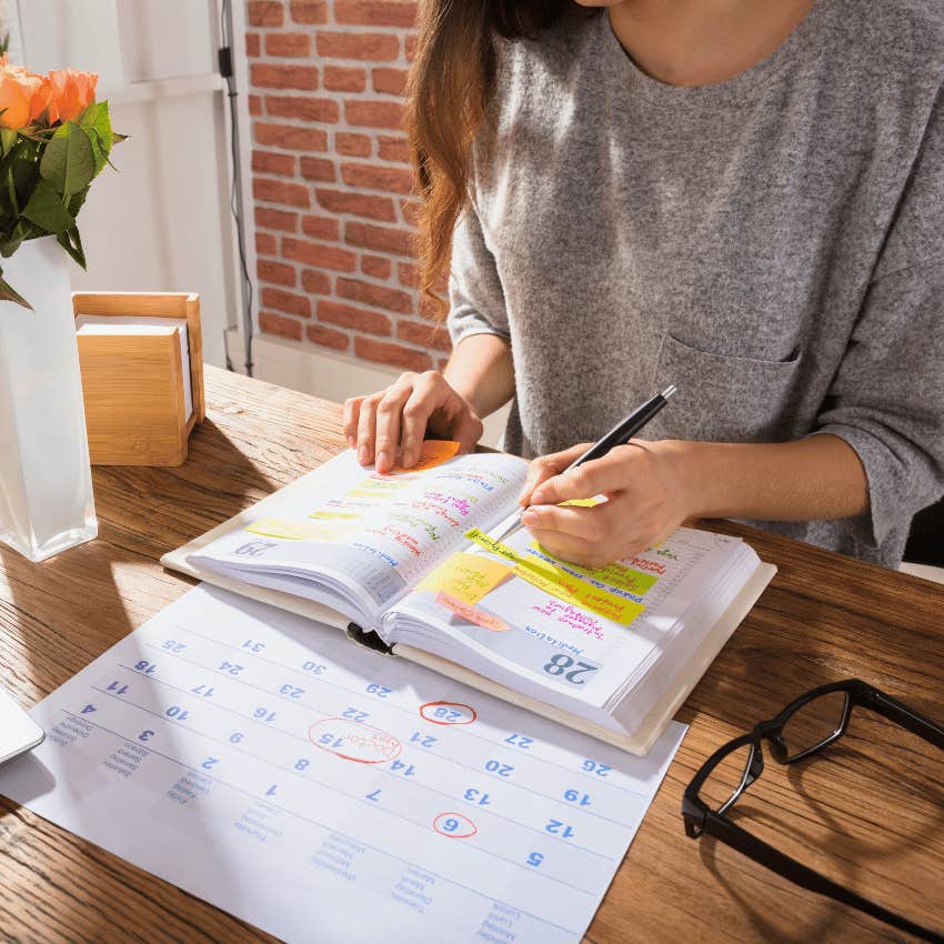 woman planning her schedule in planner
