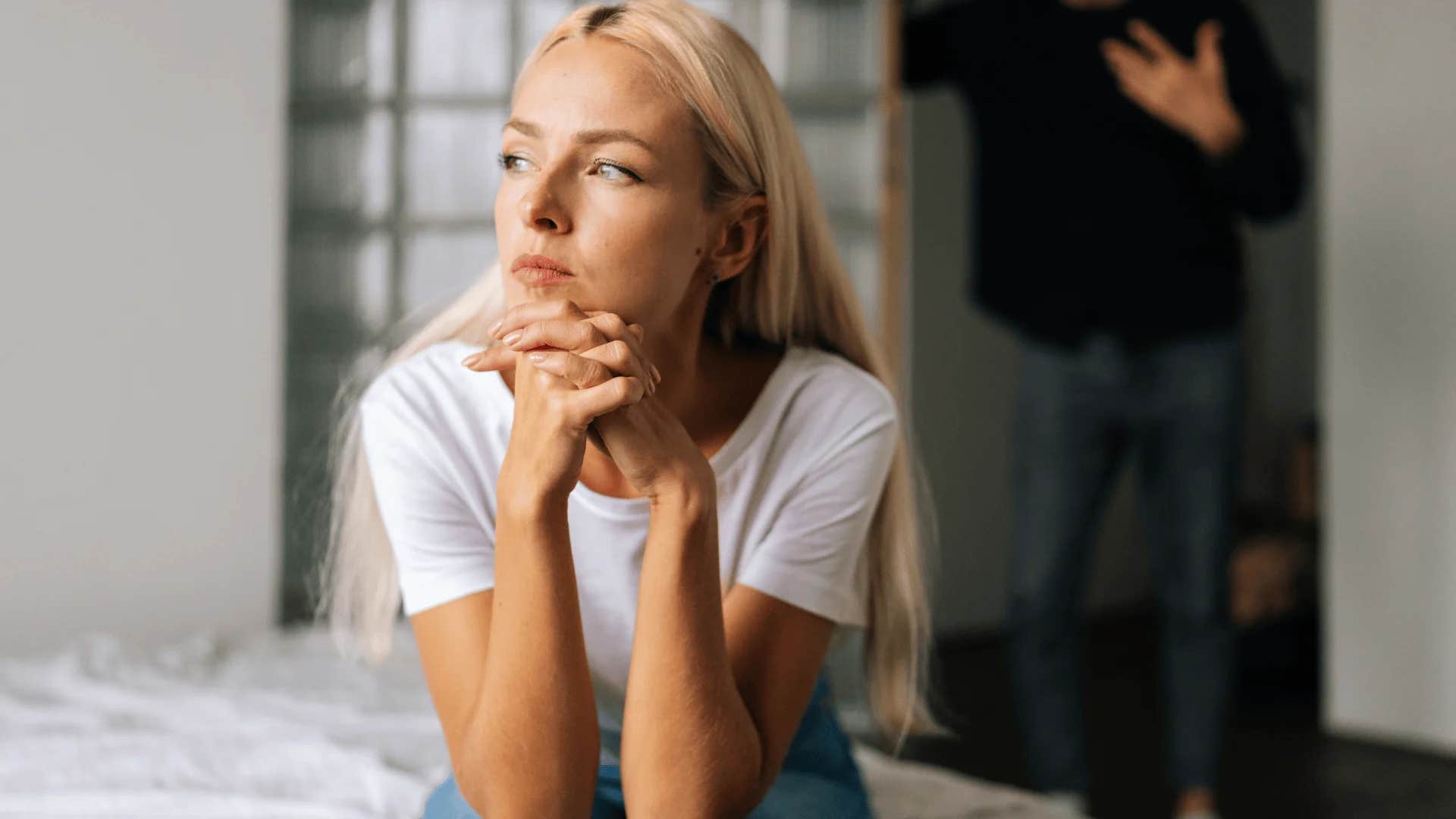 woman turned away from man saying i don't owe you anything