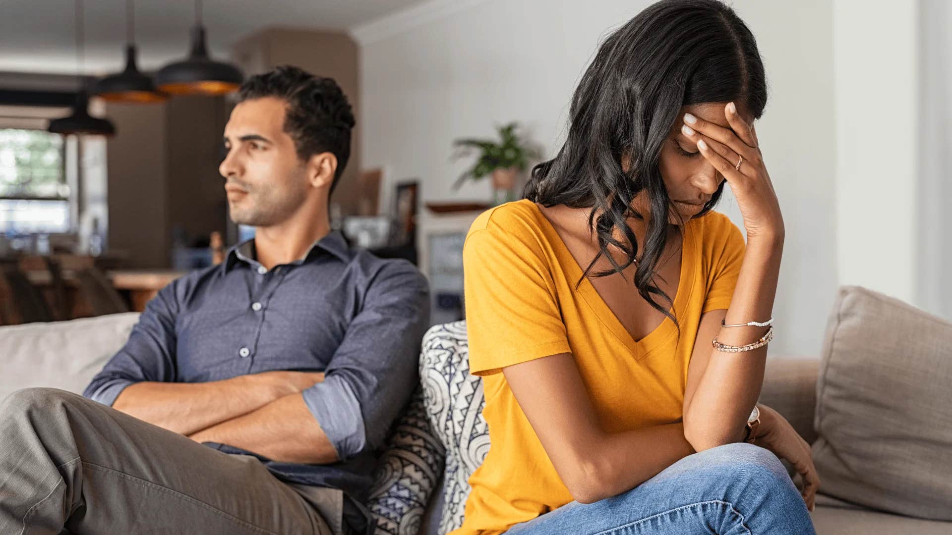 woman turned away from man saying we're not doing this again