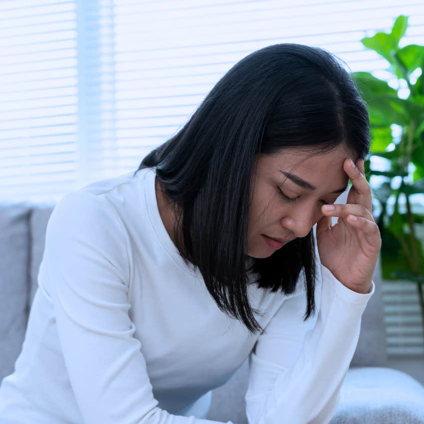 woman struggling to cope with difficult emotions at home