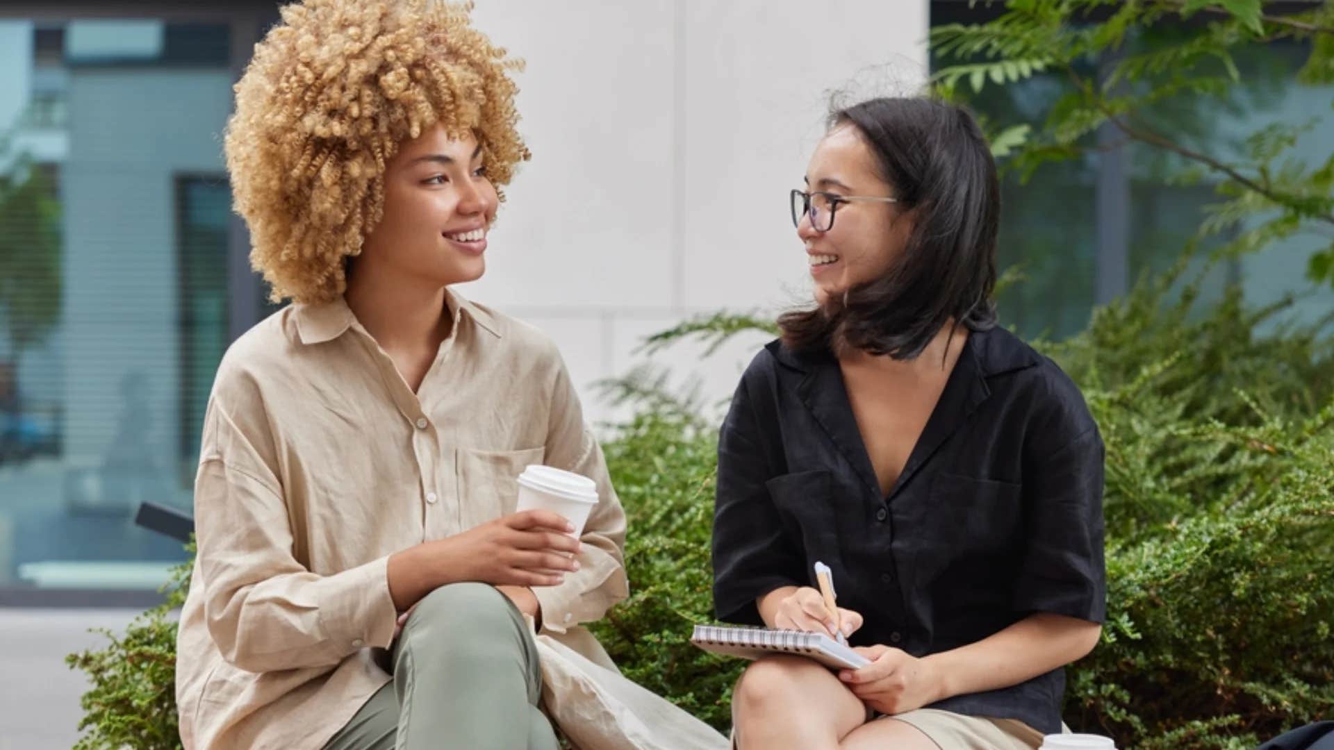 woman telling colleague good for you