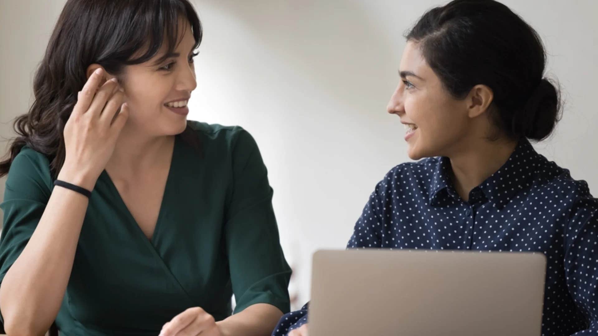 woman telling colleague that's one way of doing it