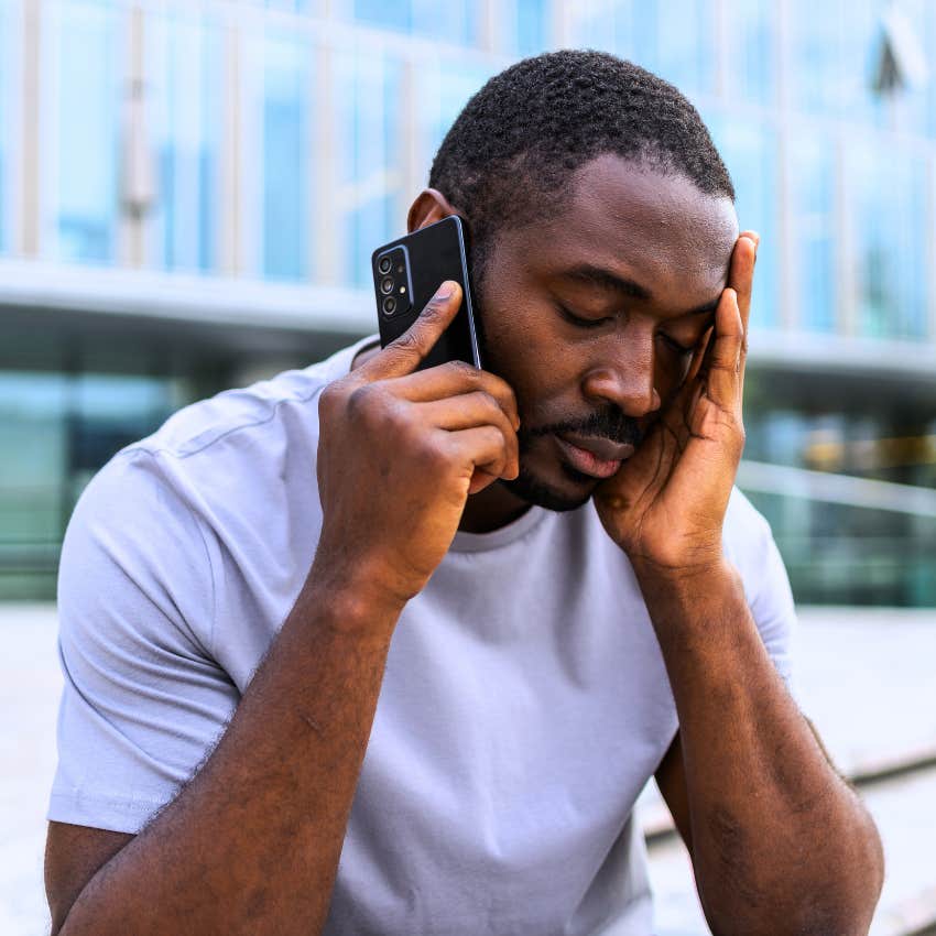 frustrated man avoiding negative emotions on a phone call