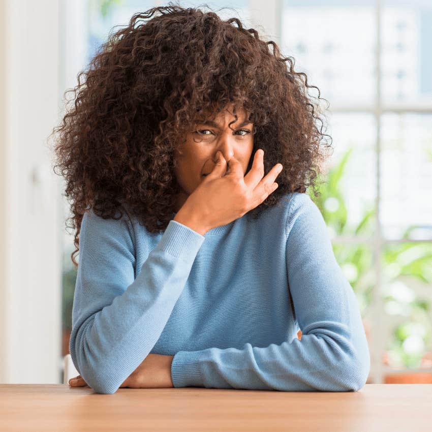 young woman with a disgusted expression