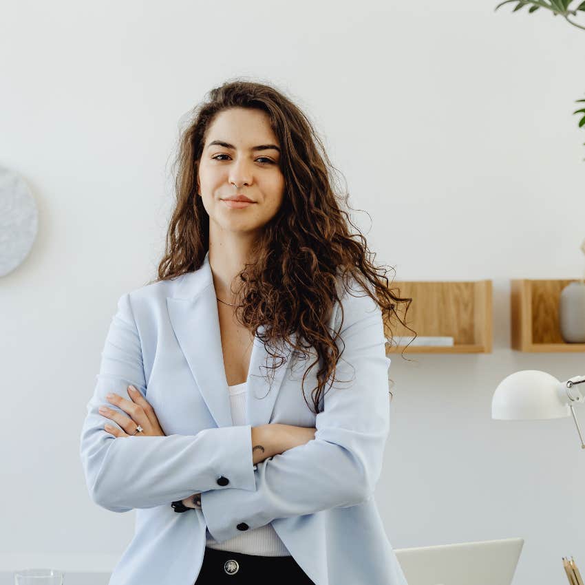 young boss with her arms crossed in the office