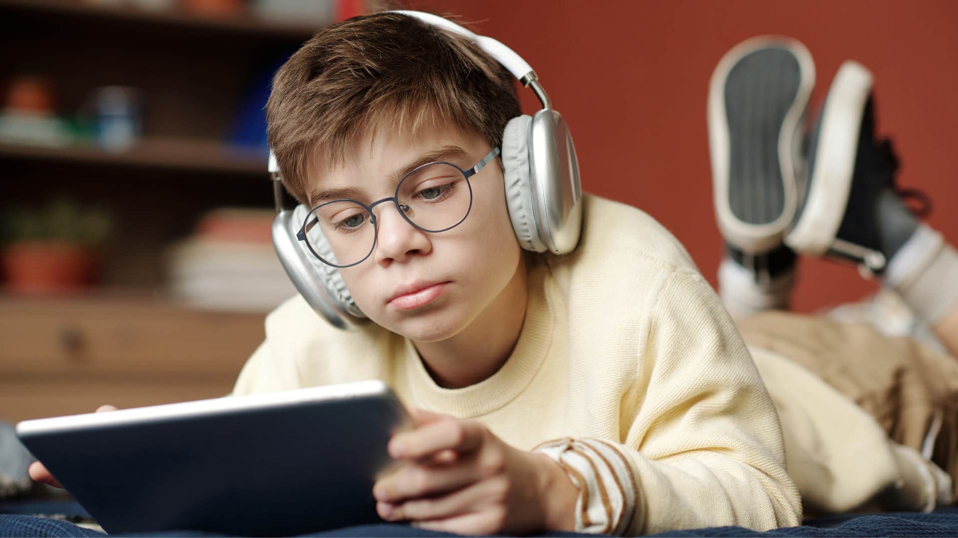 boy who spends a lot of time looking at screens