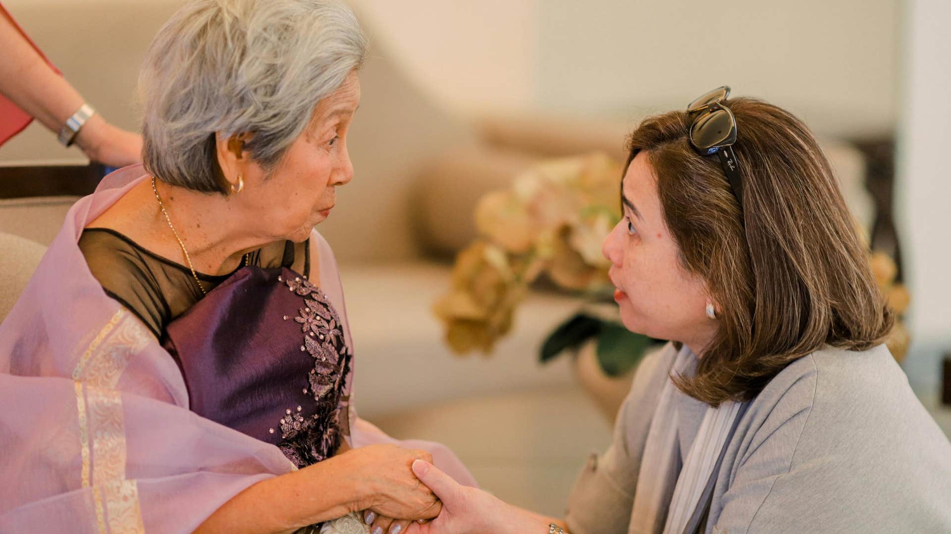 gen x woman taking care of her elderly mom