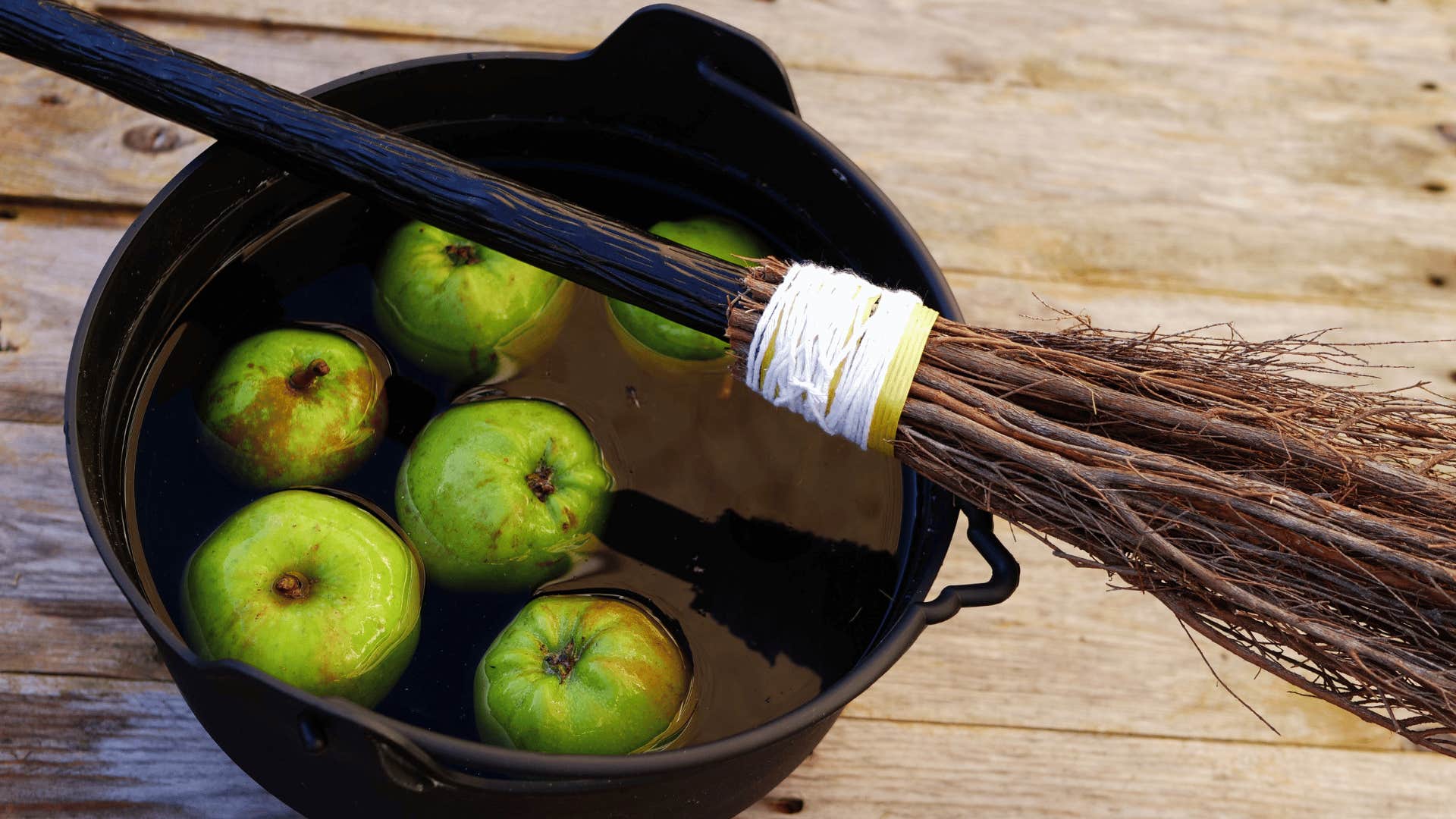 green apples being used for bobbing at halloween parties